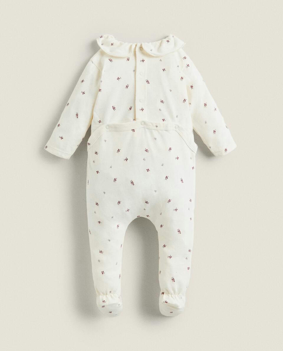 MACACÃO DE BEBÊ COM ESTAMPA FLORAL