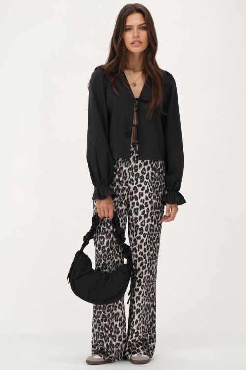 Zwarte blouse met strikjes en streepjes