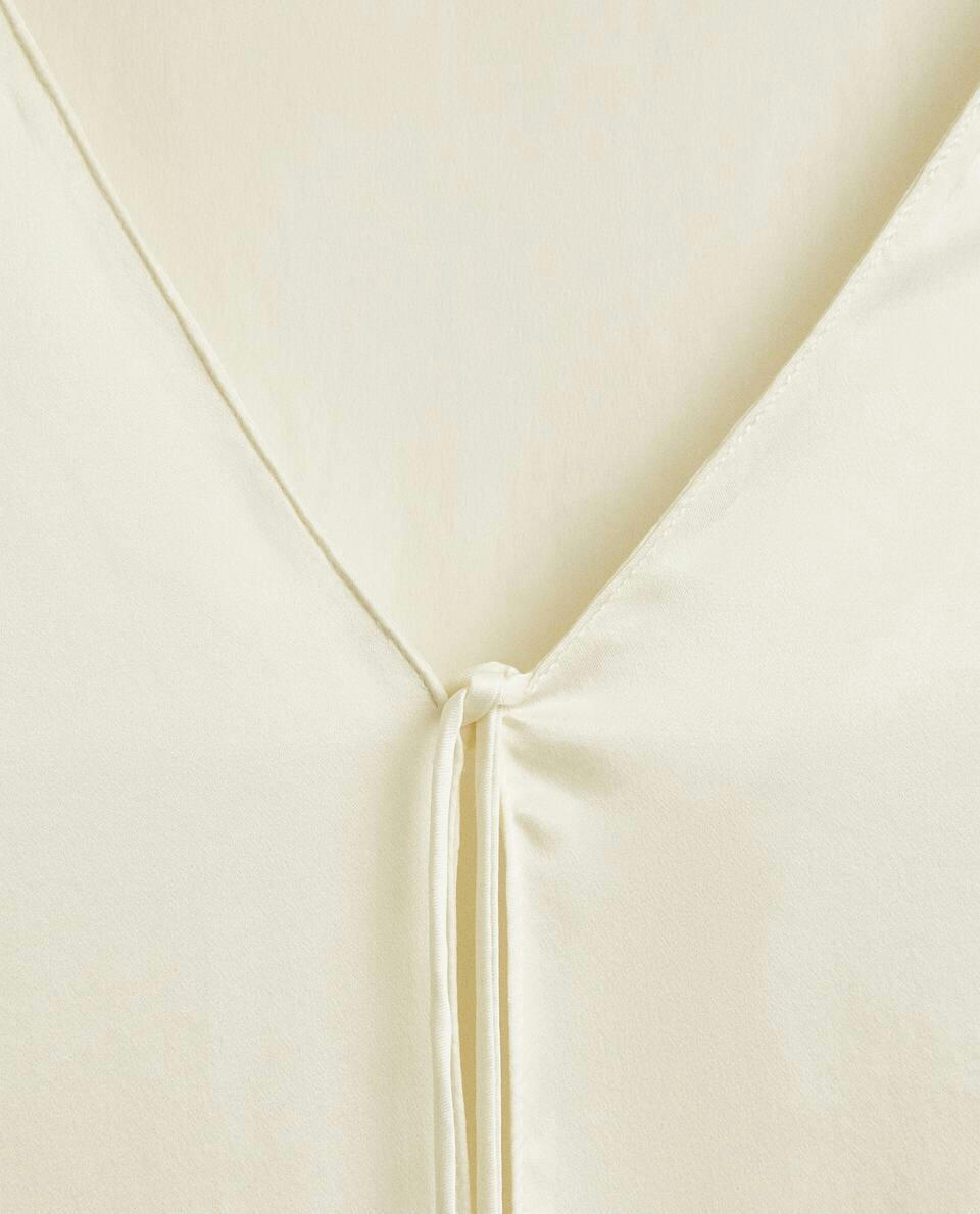 Blusa de seda crua