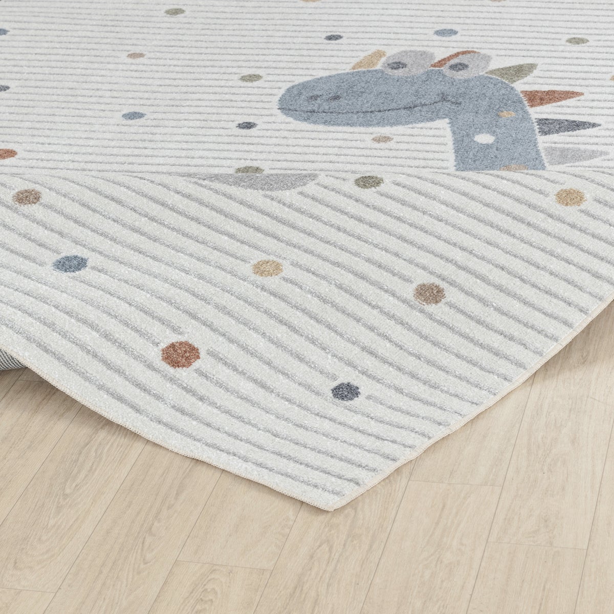 Machinewasbaar kinderkleed met dinosaurusmotief, beige/grijs, 80x150 cm.