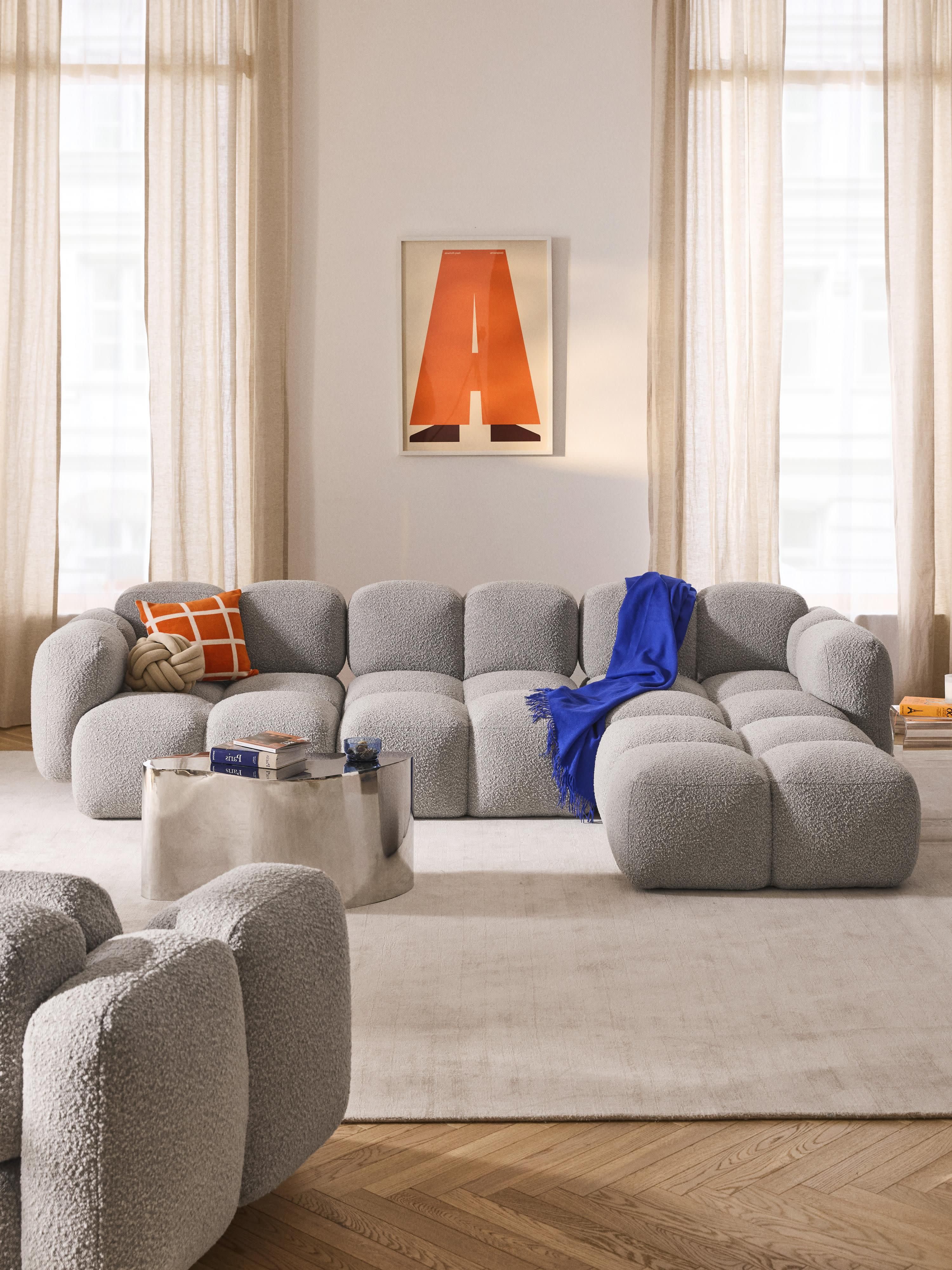 Modulaire bank Tayla (4-zits) van bouclé met poef (links/rechts)