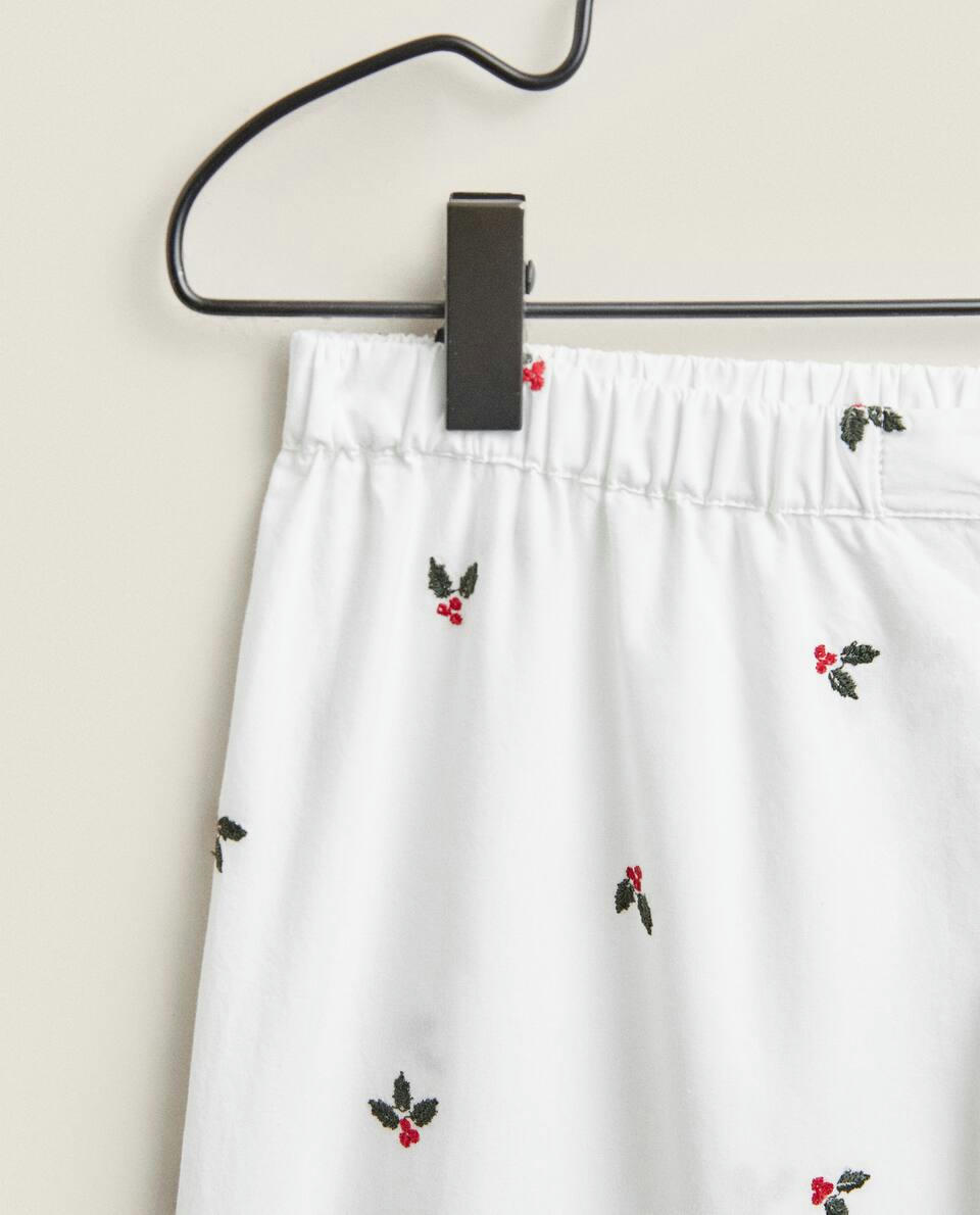 Calça de pijama de algodão com azevinho natalino