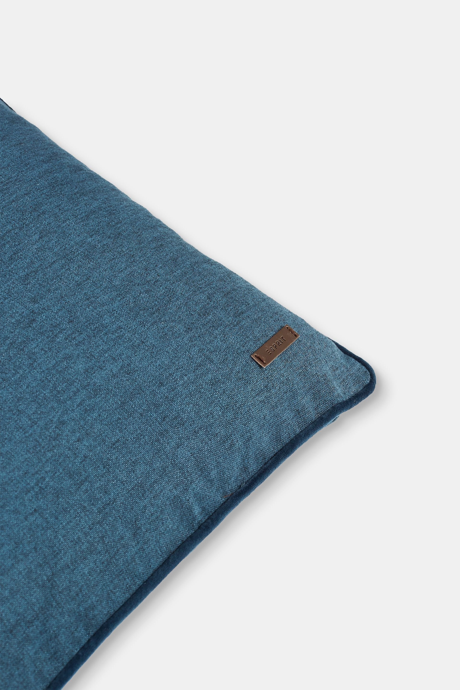 Housse de coussin décorative rehaussée d’un passepoil en velours