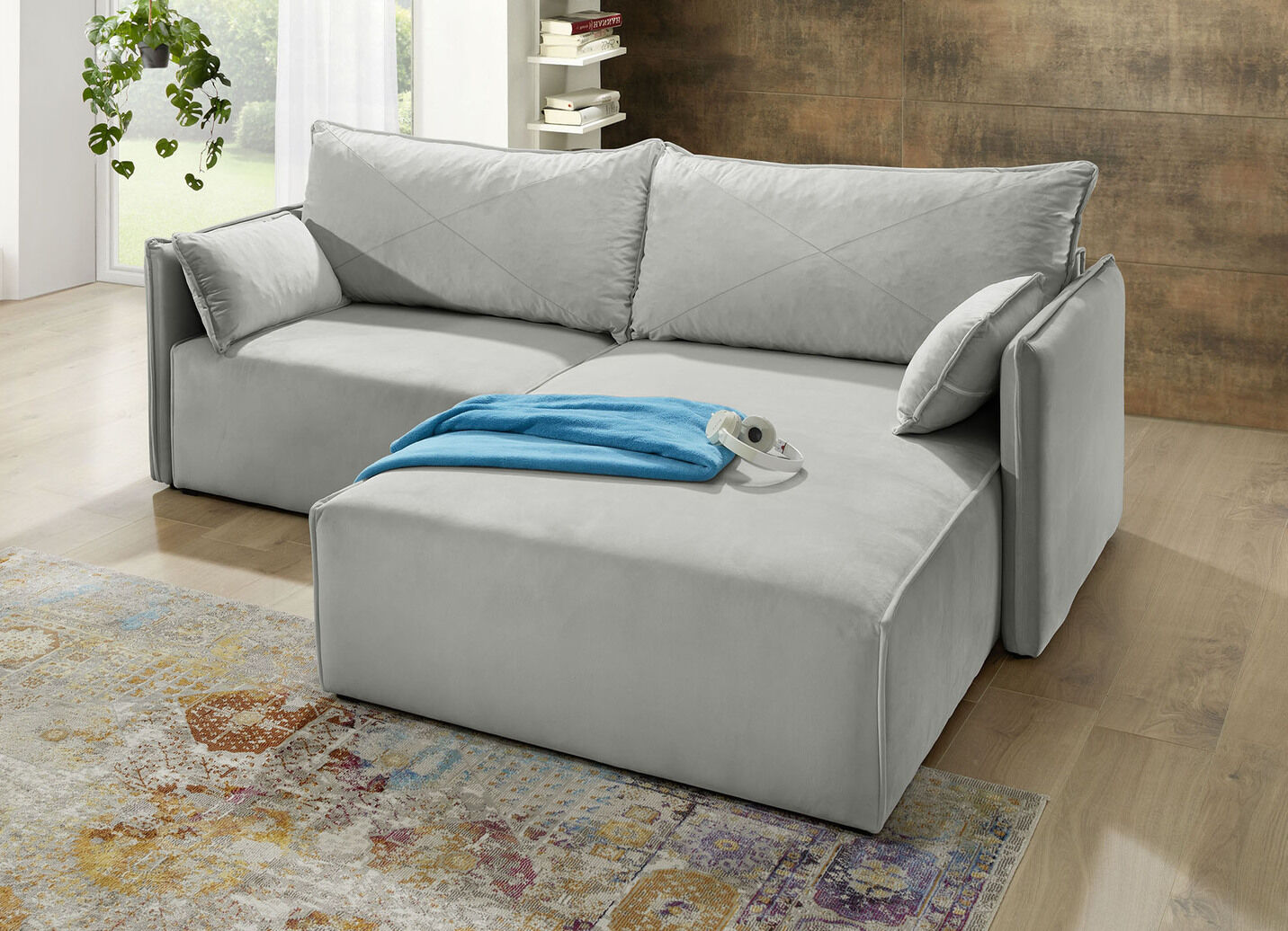 Polsterecke mit Bettfunktion und Hocker