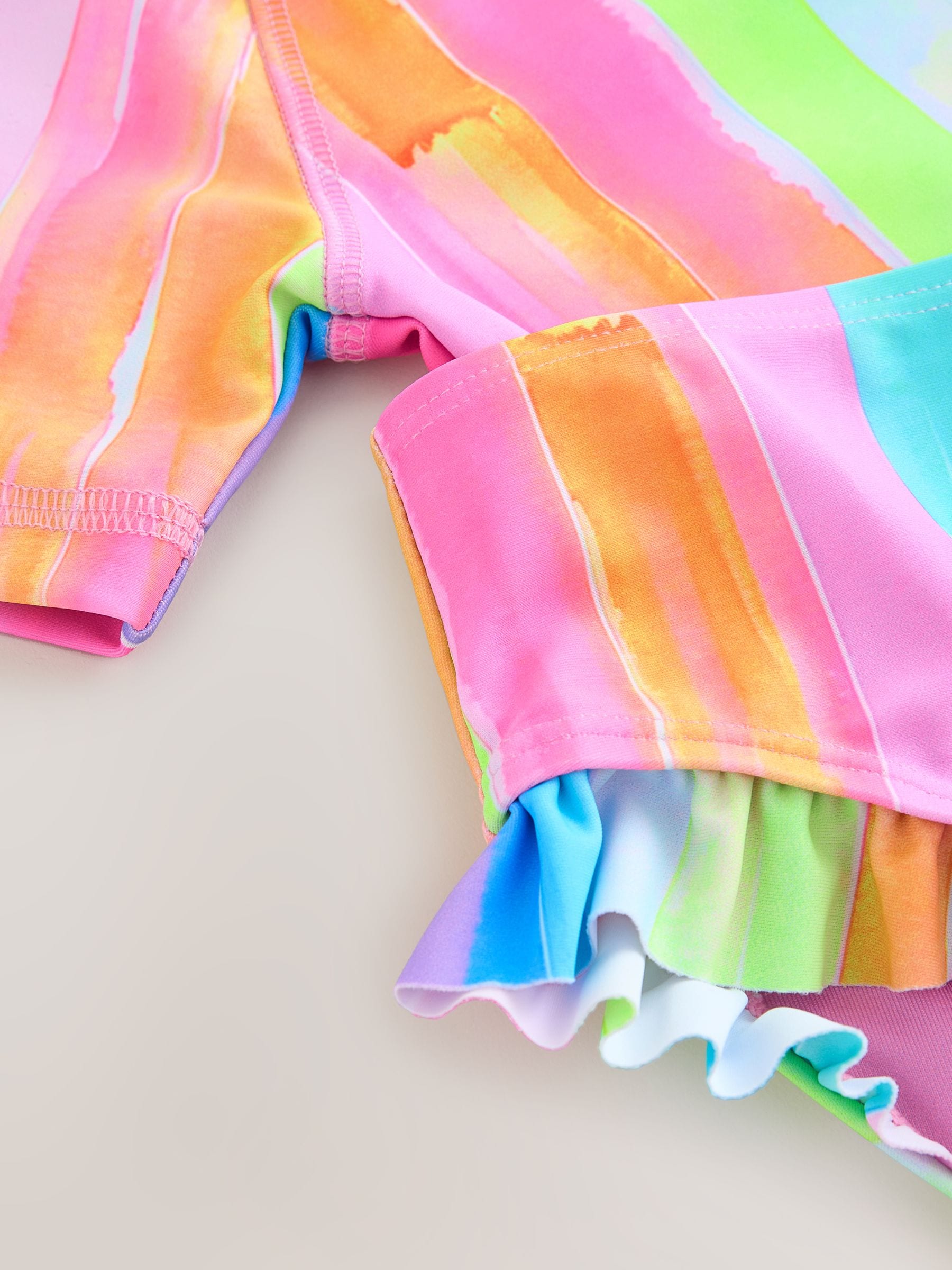 Regenboogstrepen - Zonbeschermende zwemset met korte mouwen (3mnd-10jr)