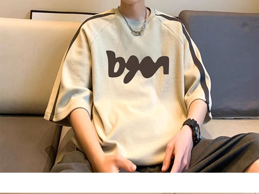 FOEV - T-shirt met ronde hals en letters, elleboogmouwen en raglanmouwen