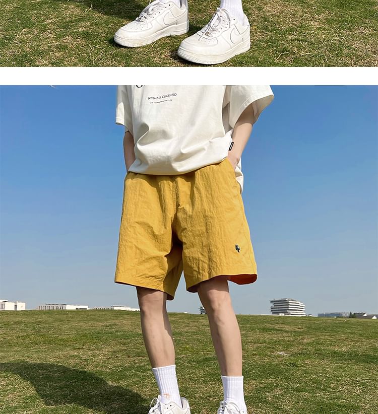 AXEN - Wijde shorts met geborduurde letters en middelhoge taille