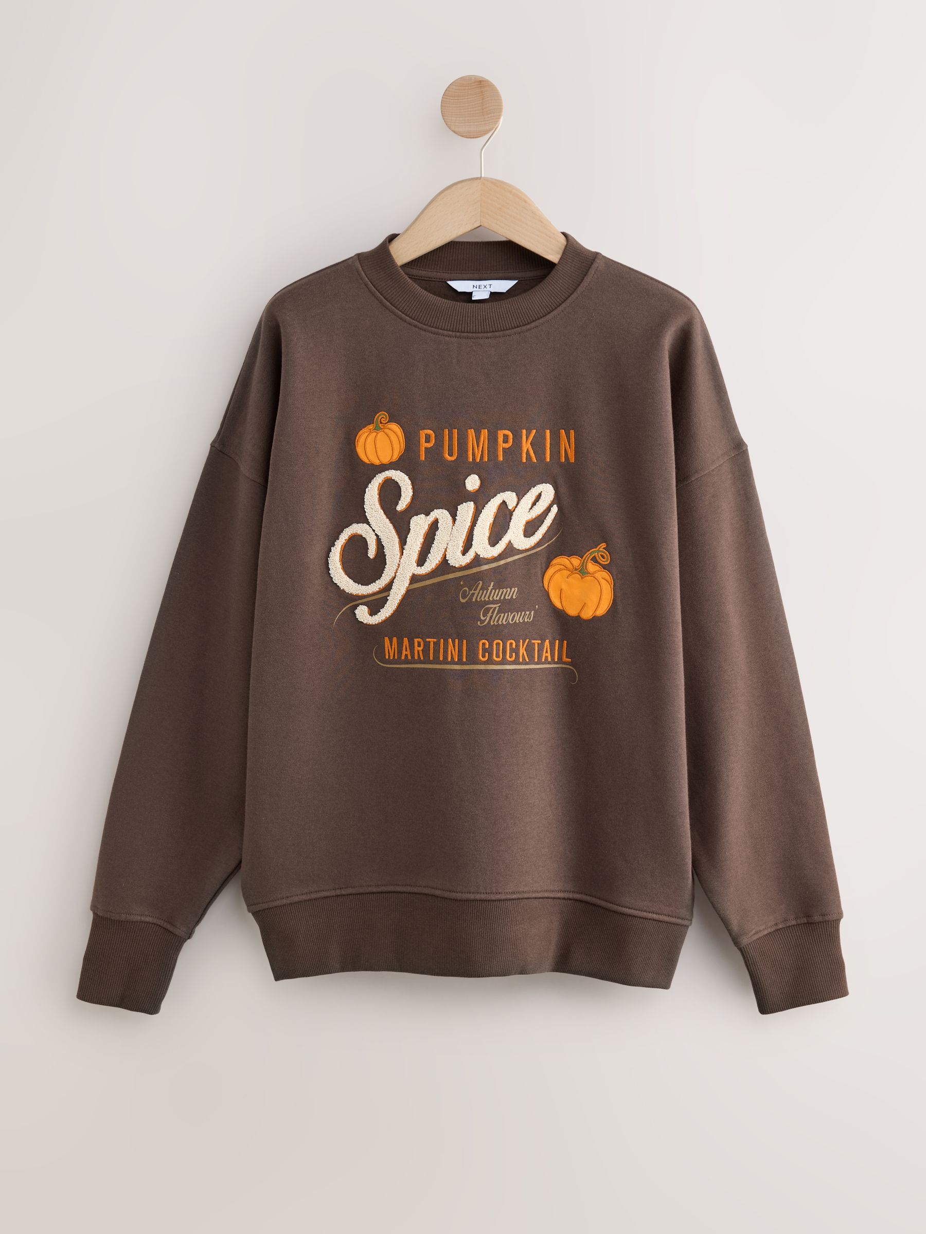 Chocoladebruin - Grafische Halloween-pompoen Martini crewneck sweatshirt met lange mouwen