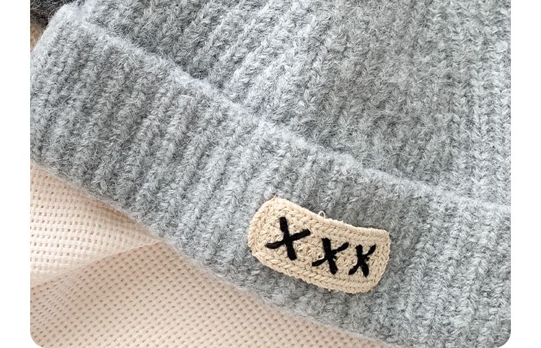 Amandier - Gebreide muts met appliqué