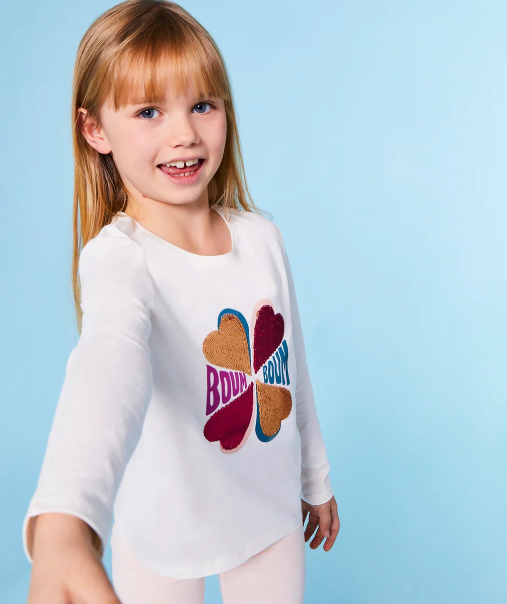 T-SHIRT FILLE EN COTON BIO ÉCRU AVEC FLEUR À SEQUINS RÉVERSIBLES