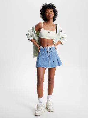 Top cropped ultra com amarração nas costas e distintivo