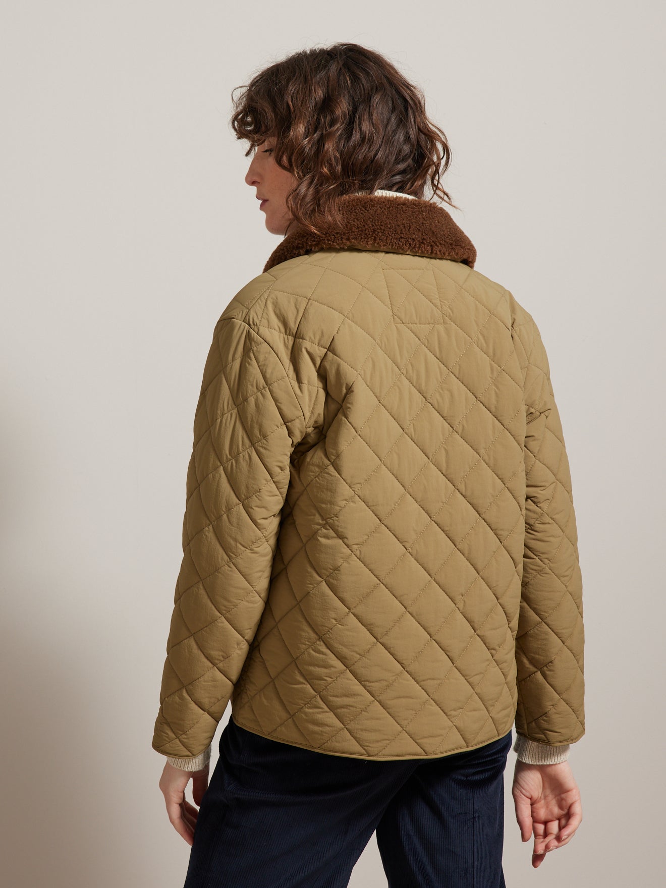 Veste matelassée col fausse fourrure femme