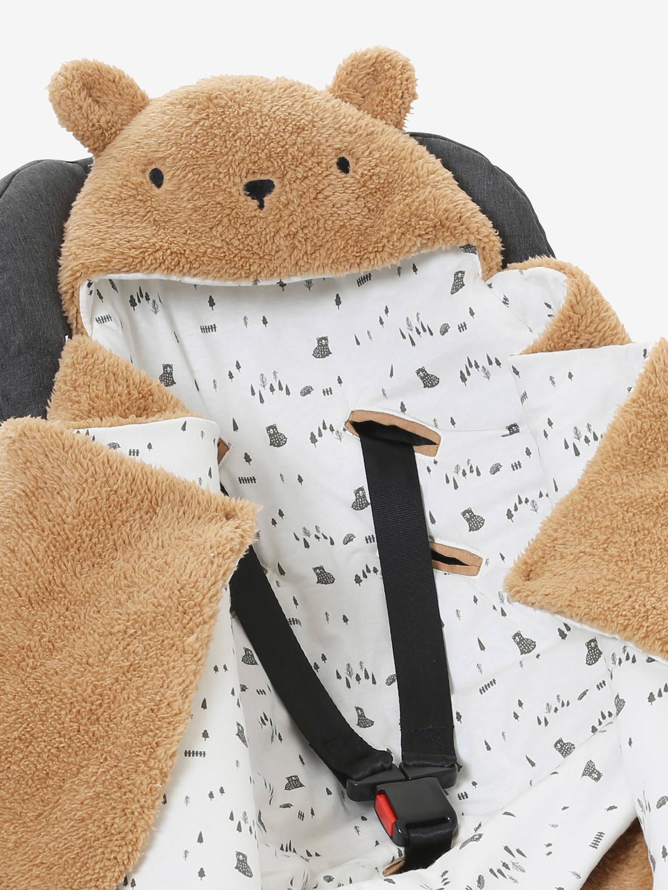 Saco transformável em brinquedo de pelúcia. Urso de pelúcia liso bege claro com estampas.