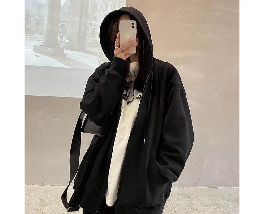 Hevnir - Effen oversized hoodie met rits