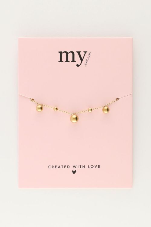 Armband met bolletjes bedels