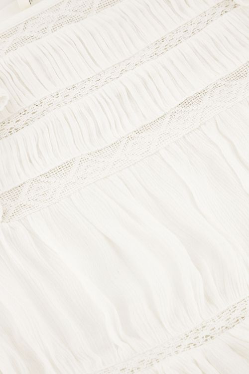 Witte top met lange mouwen met tapes en ruffles