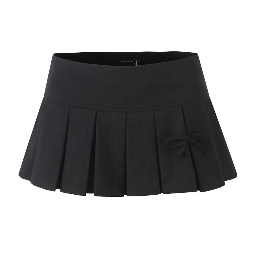 Asiris - Laag uitgesneden geplooide rok met strikaccent