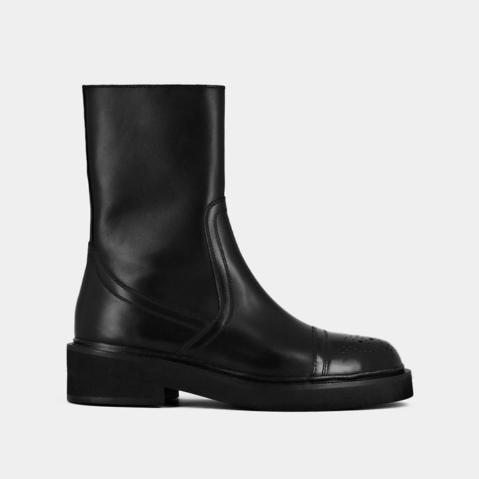 Bottines à empiecement et surpiqures  en cuir noir
