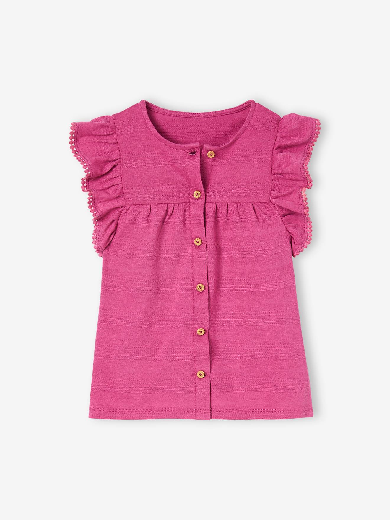 Look da menina: blusa com babados e shorts de tricô rosa com estampa de peônias.