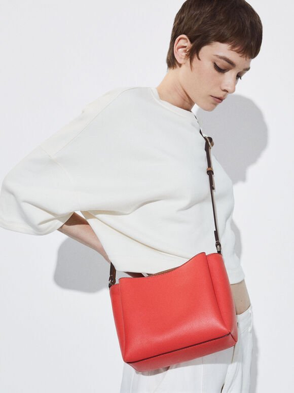 Bolsa transversal com vários bolsos - Coral