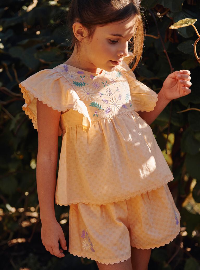Blouse orange clémentine à broderies fleuries
