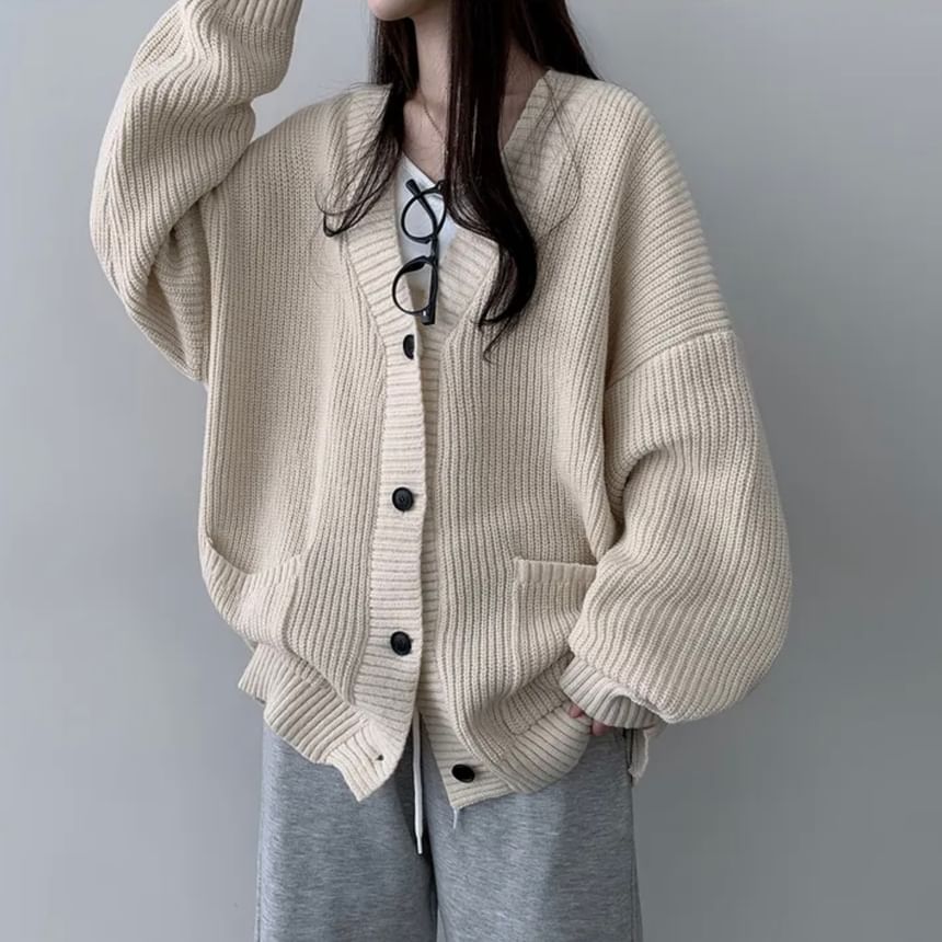 Coris - Oversized vest met pofmouwen, V-hals en effen zakdetail