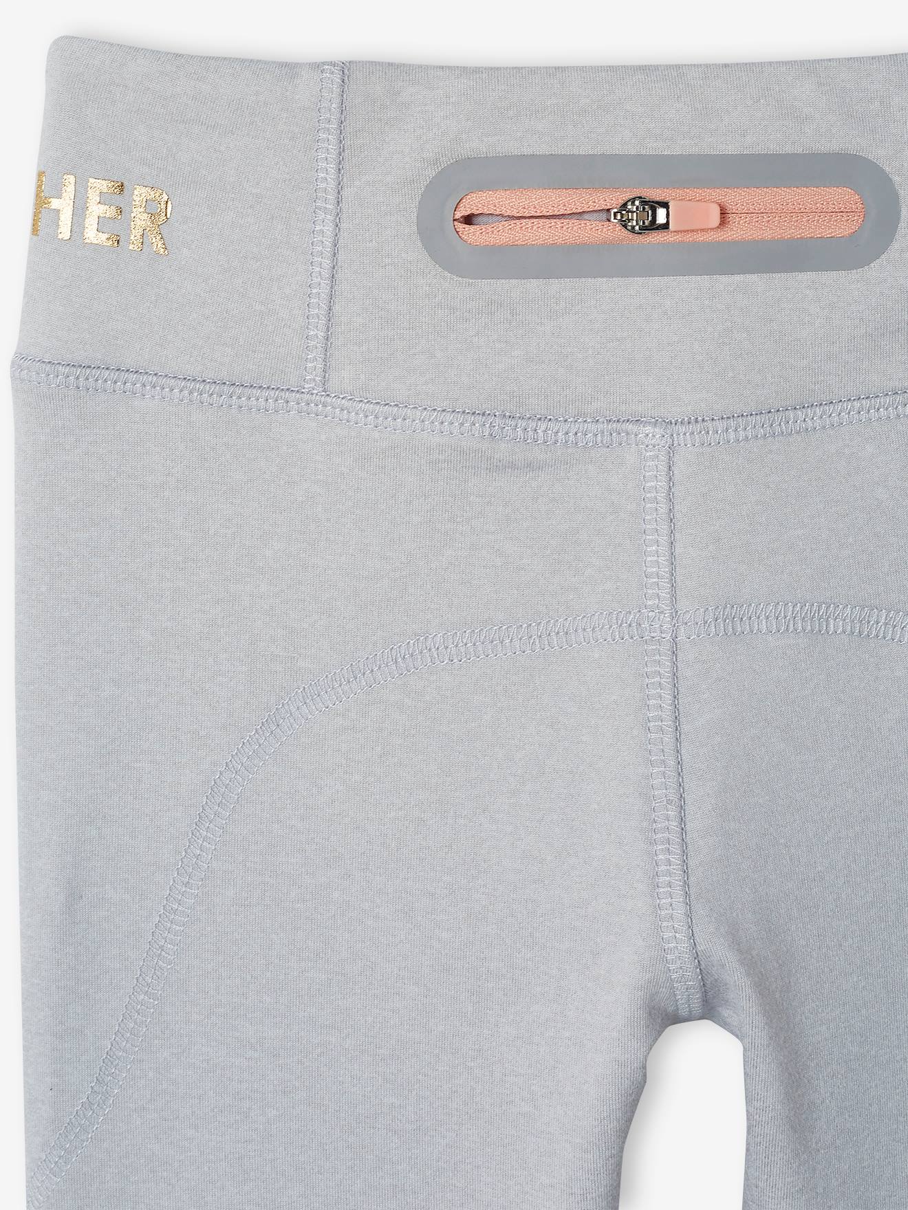 Conjunto de agasalho feminino cor pêssego: blusa de moletom com zíper e calça legging técnica.