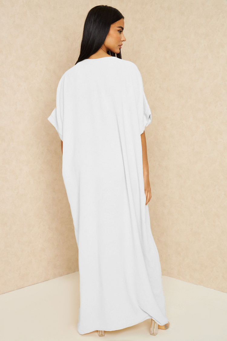 Abaya blanche à broderies dorées