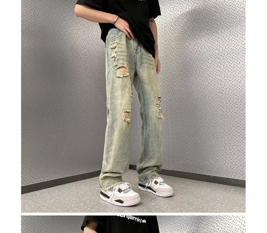Femilina - High-waist distressed washed jeans met wijde pijpen