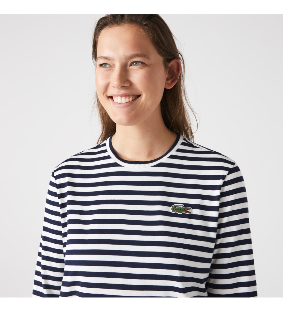 Camiseta Lacoste com logo azul-marinho e detalhes em branco.