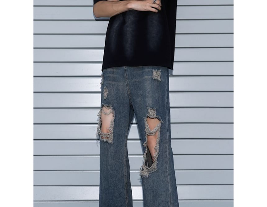 Trimecca - Hoge taille jeans met wijde pijpen en versleten look
