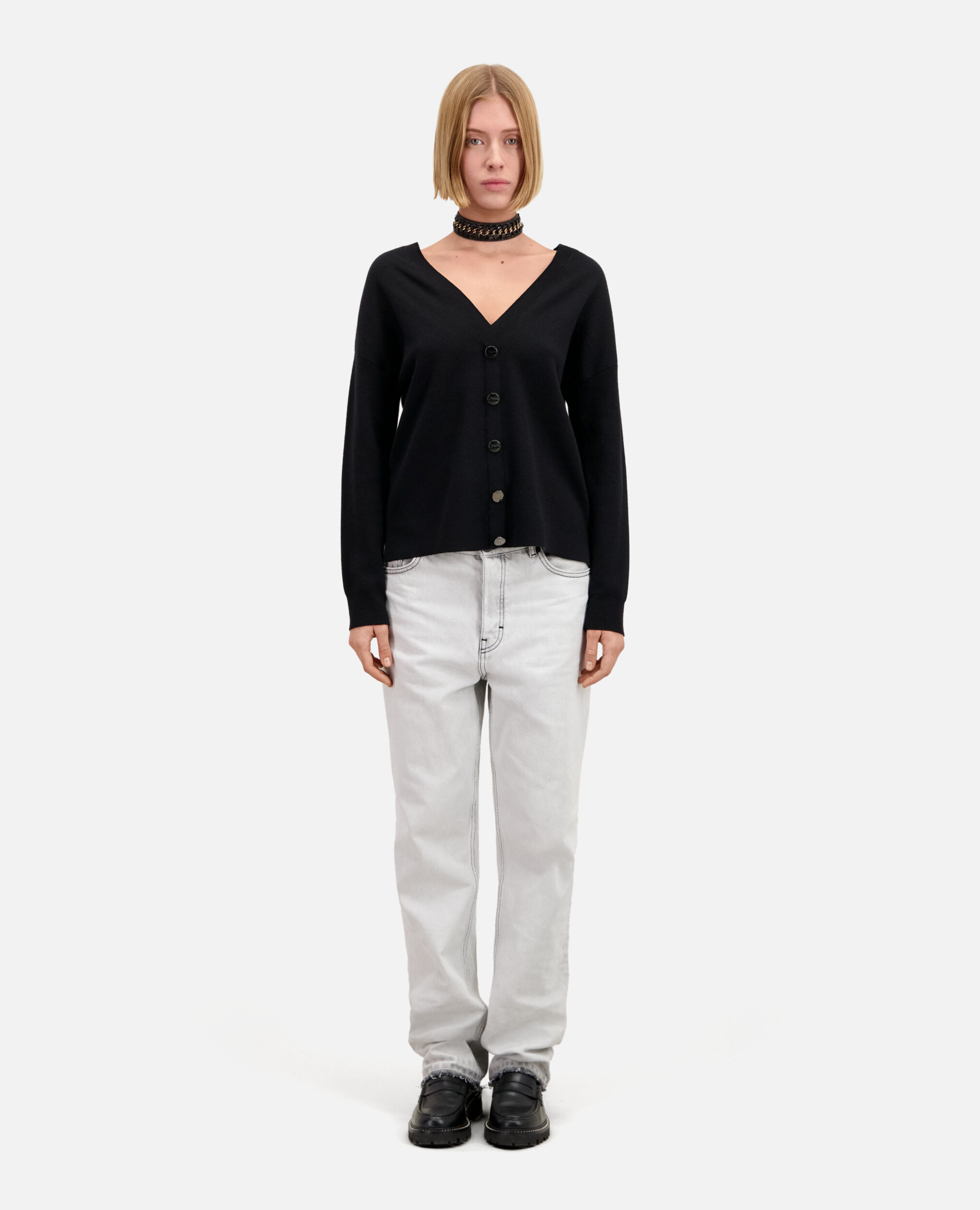 Ecru sweater with buttoning on the back