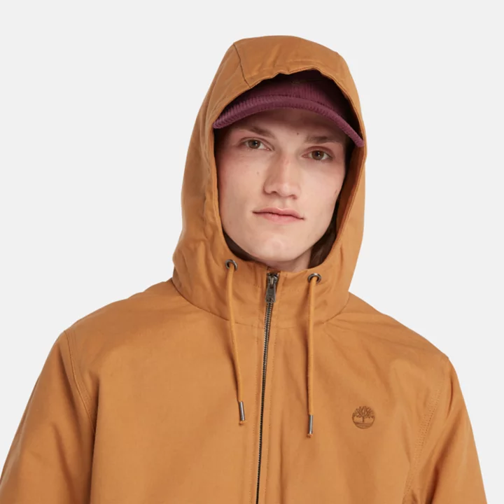 Jaqueta bomber masculina com capuz e isolamento térmico em lona laranja.