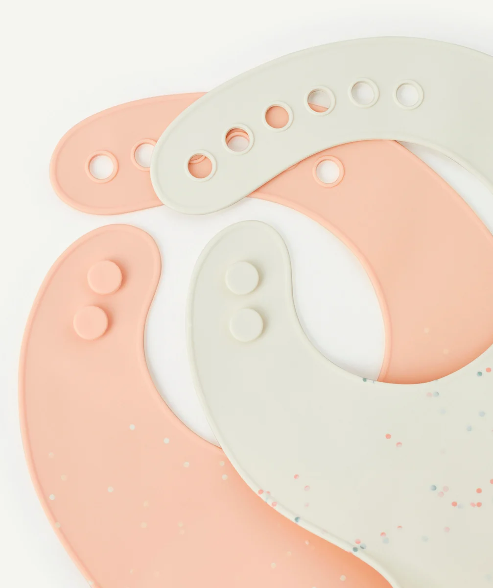 LASSIGLOT 2 BAVOIRS EN SILICONE COULEUR ABRICOT ET BLANC