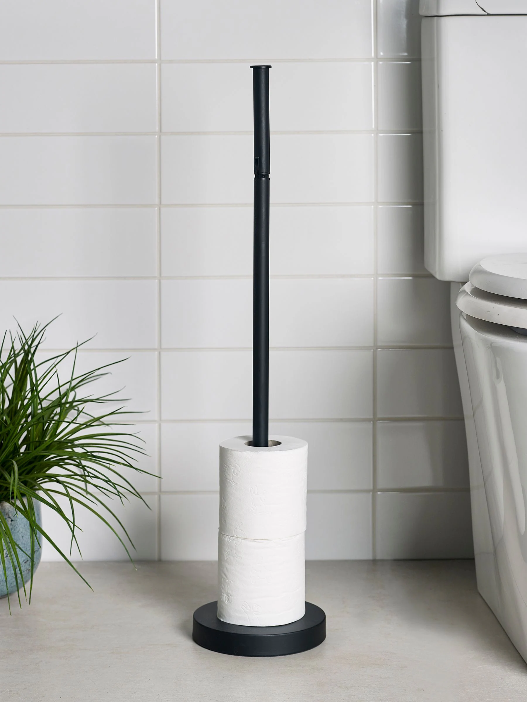 Toiletrolhouder met roterende bovenkant