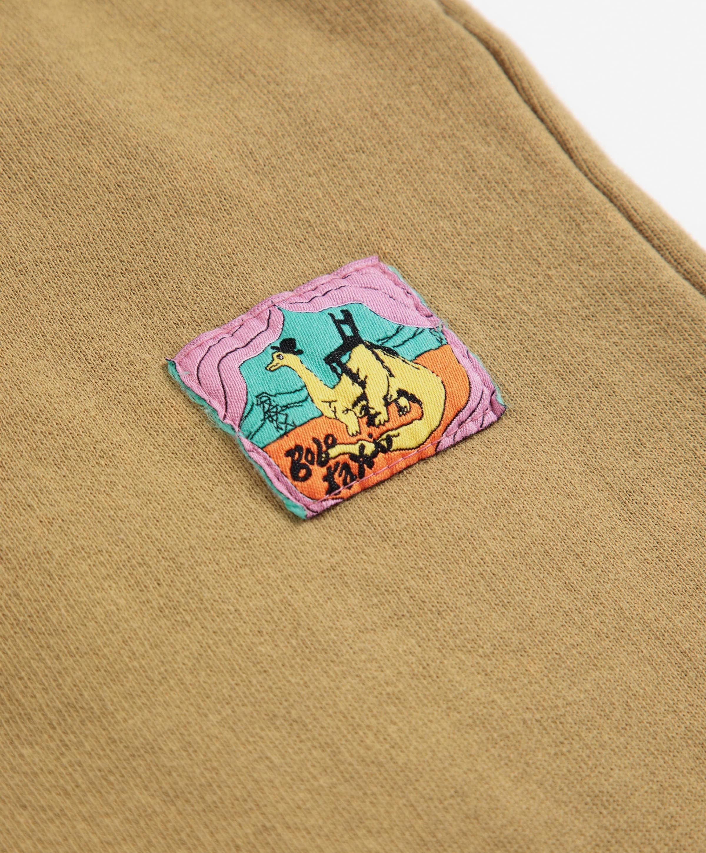 Bobo Choses Taxi Saurus Tag Cocoon Jogging jongens broek beige