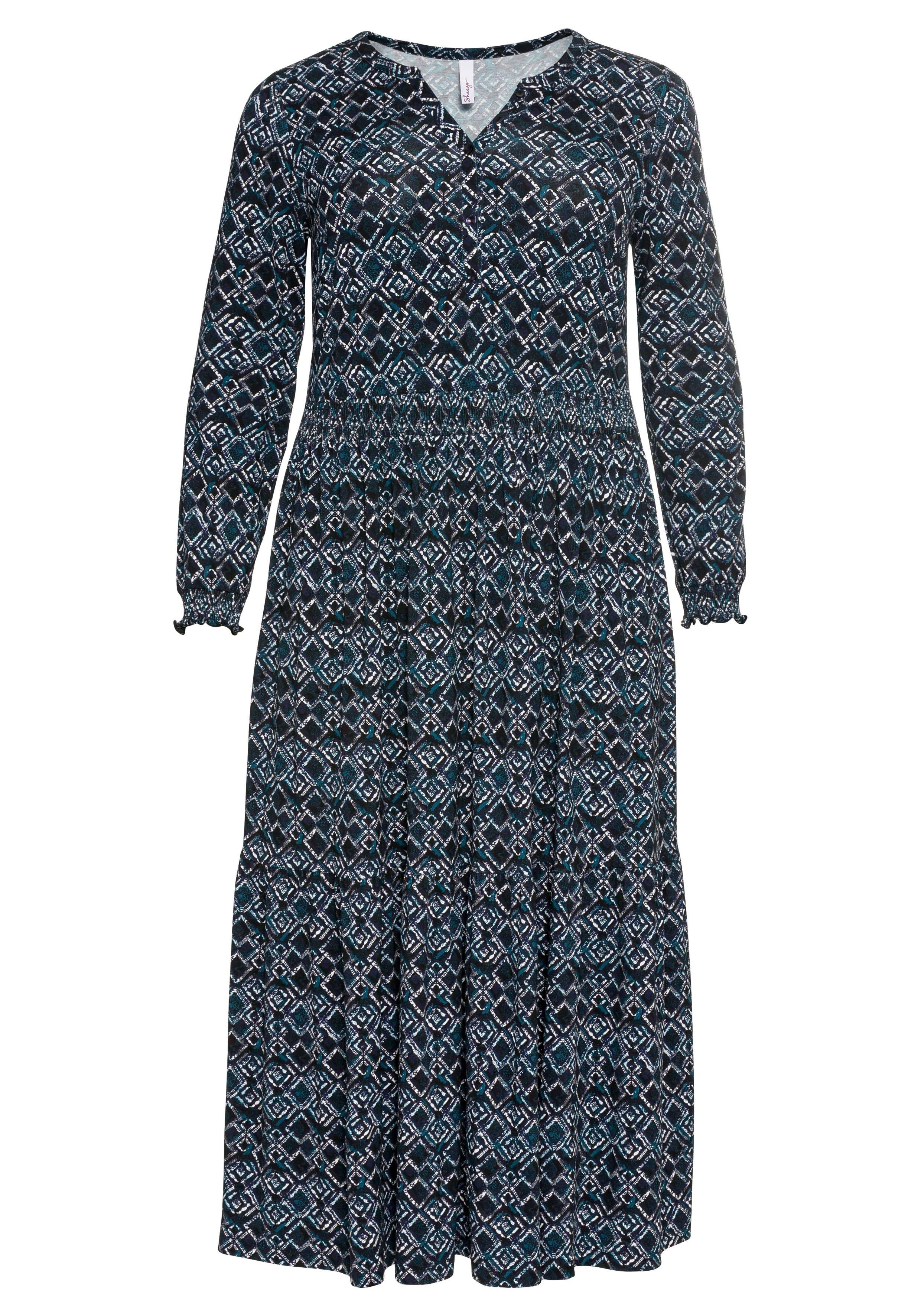 Jerseykleid mit Alloverdruck und Smokdetails