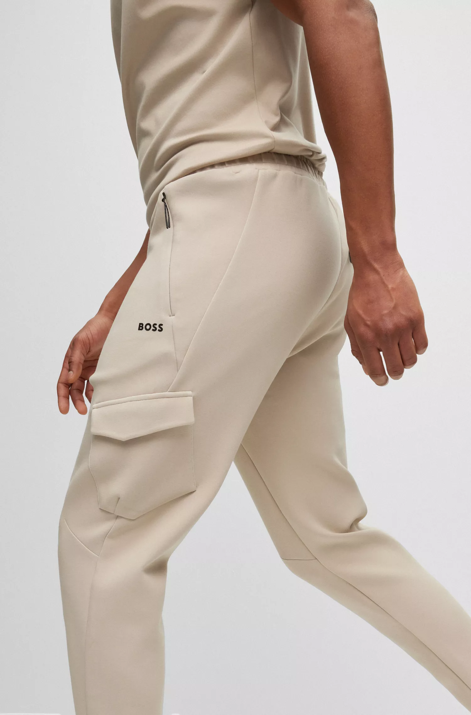 Calça de fato de treino BOSS verde, em mistura de algodão elástico avançado, com bolsos com fecho de correr.