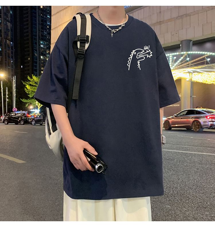 Wolfkane - Oversized T-shirt met korte mouwen, ronde hals en dinosaurusprint