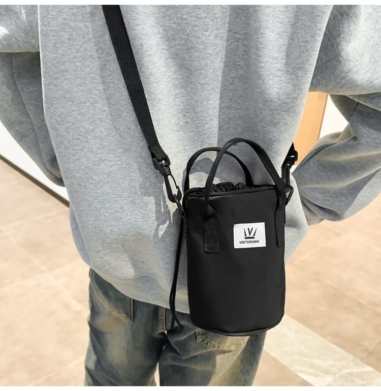 Hikuozy - Crossbodytas met trekkoord en letters