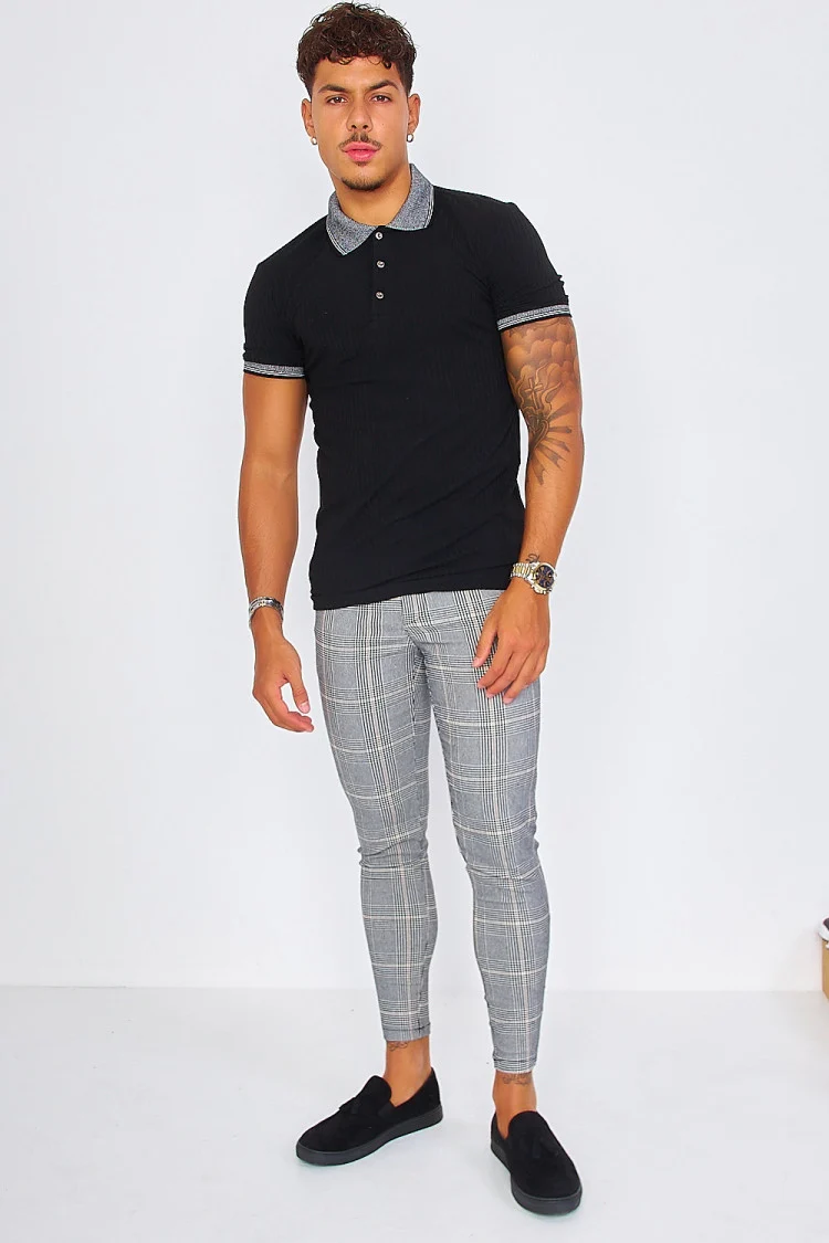 Pantalon à carreaux noir et beige