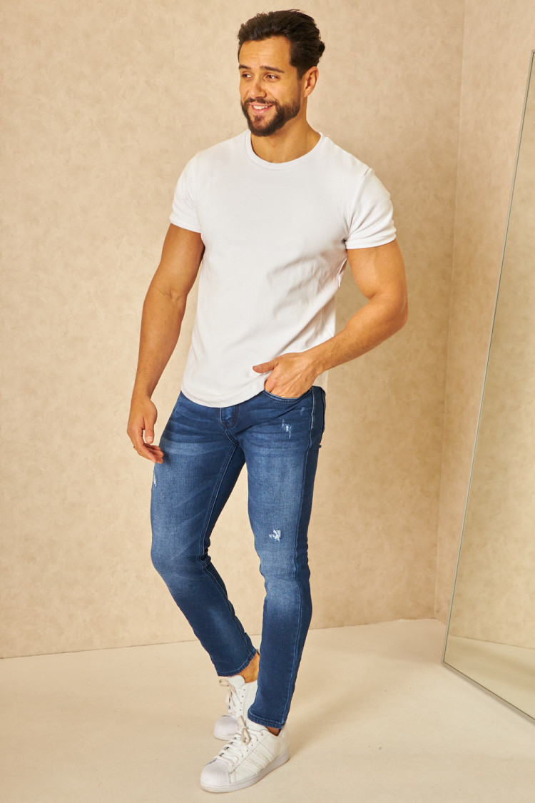 Jeans slim bleu déchiré avec élastique à la taille