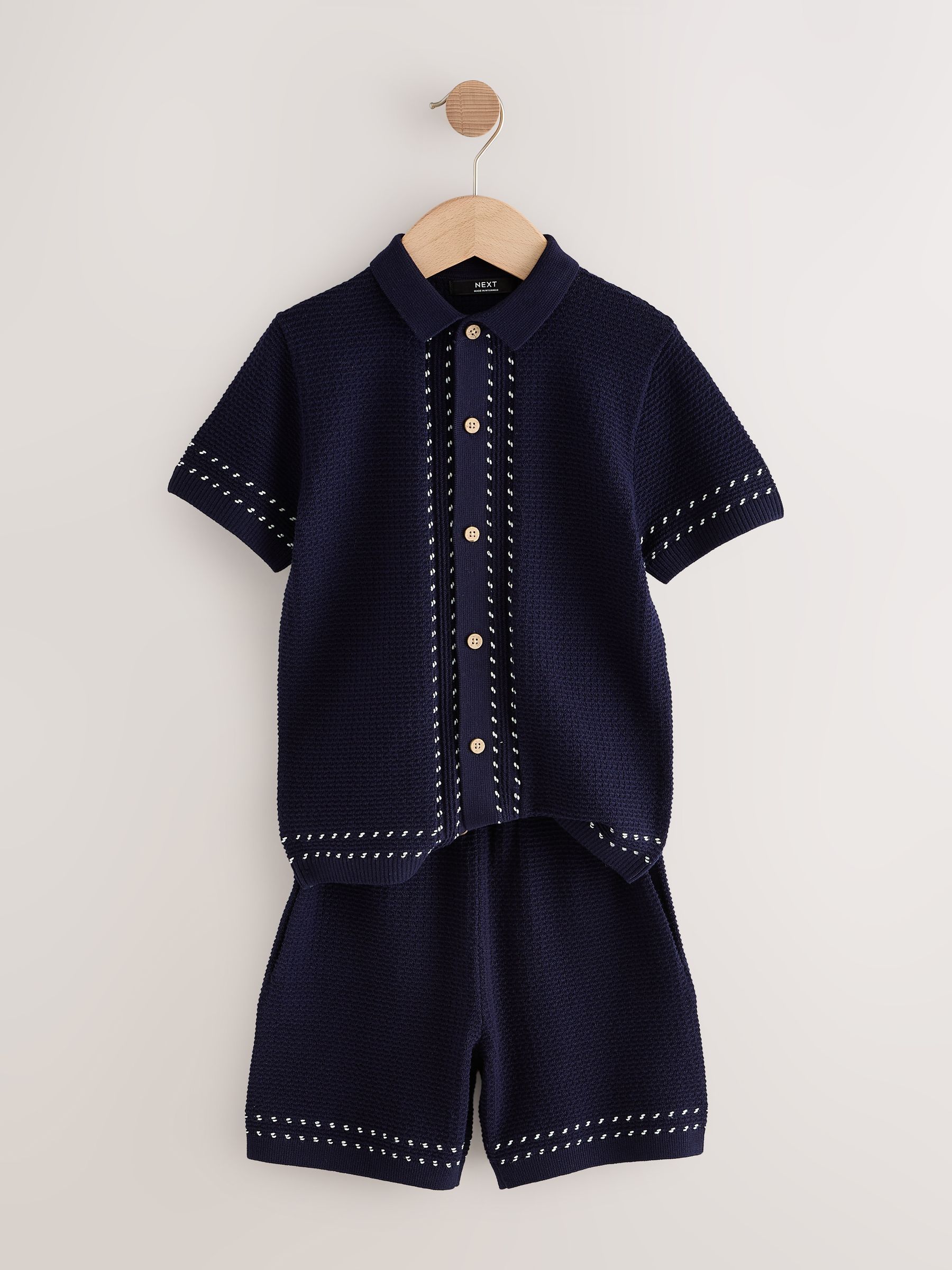 Donkerblauw - Set met getextureerd gebreid poloshirt met knoopsluiting en short (3-16jr)