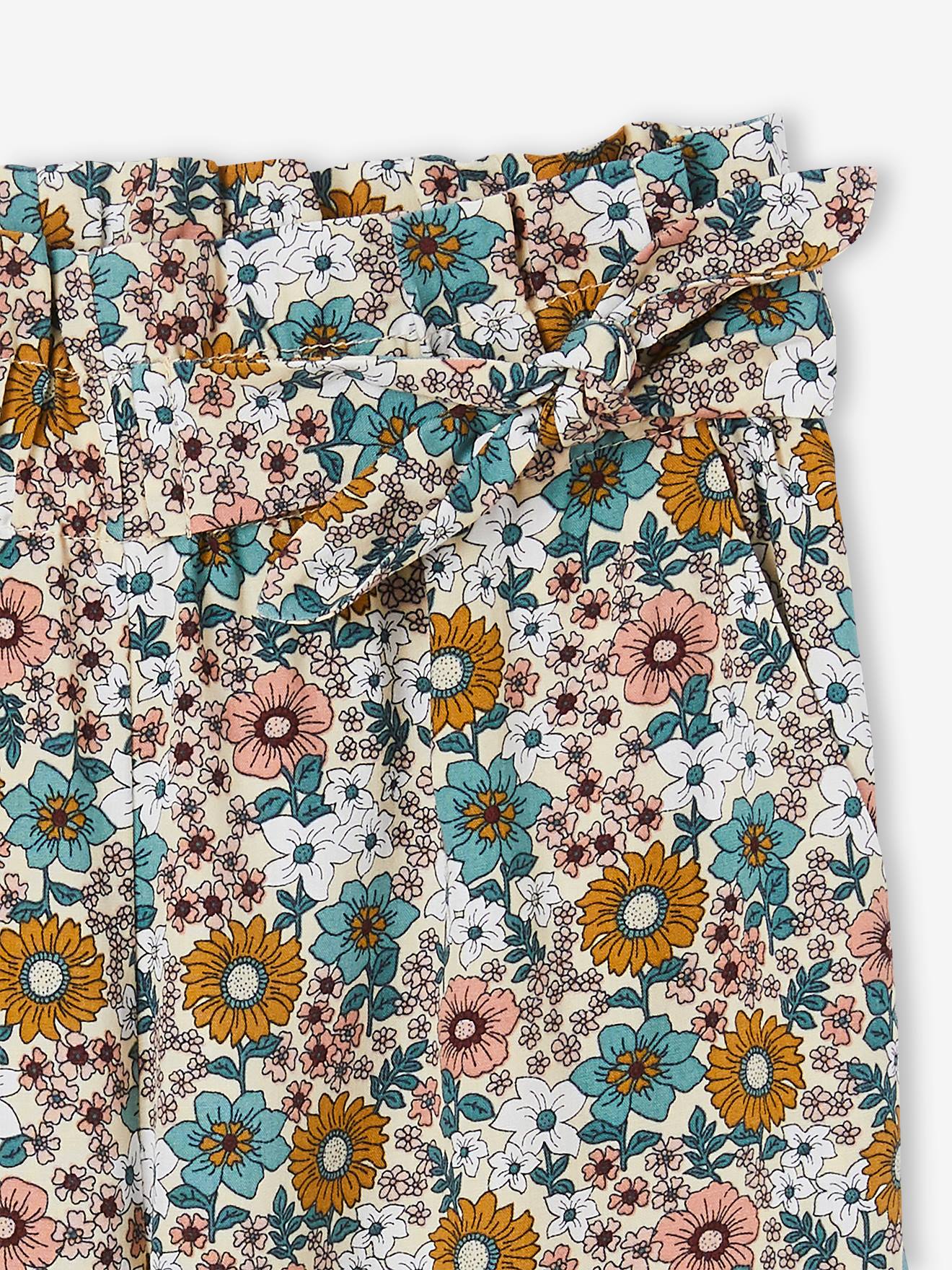Calças com estampa floral mostarda