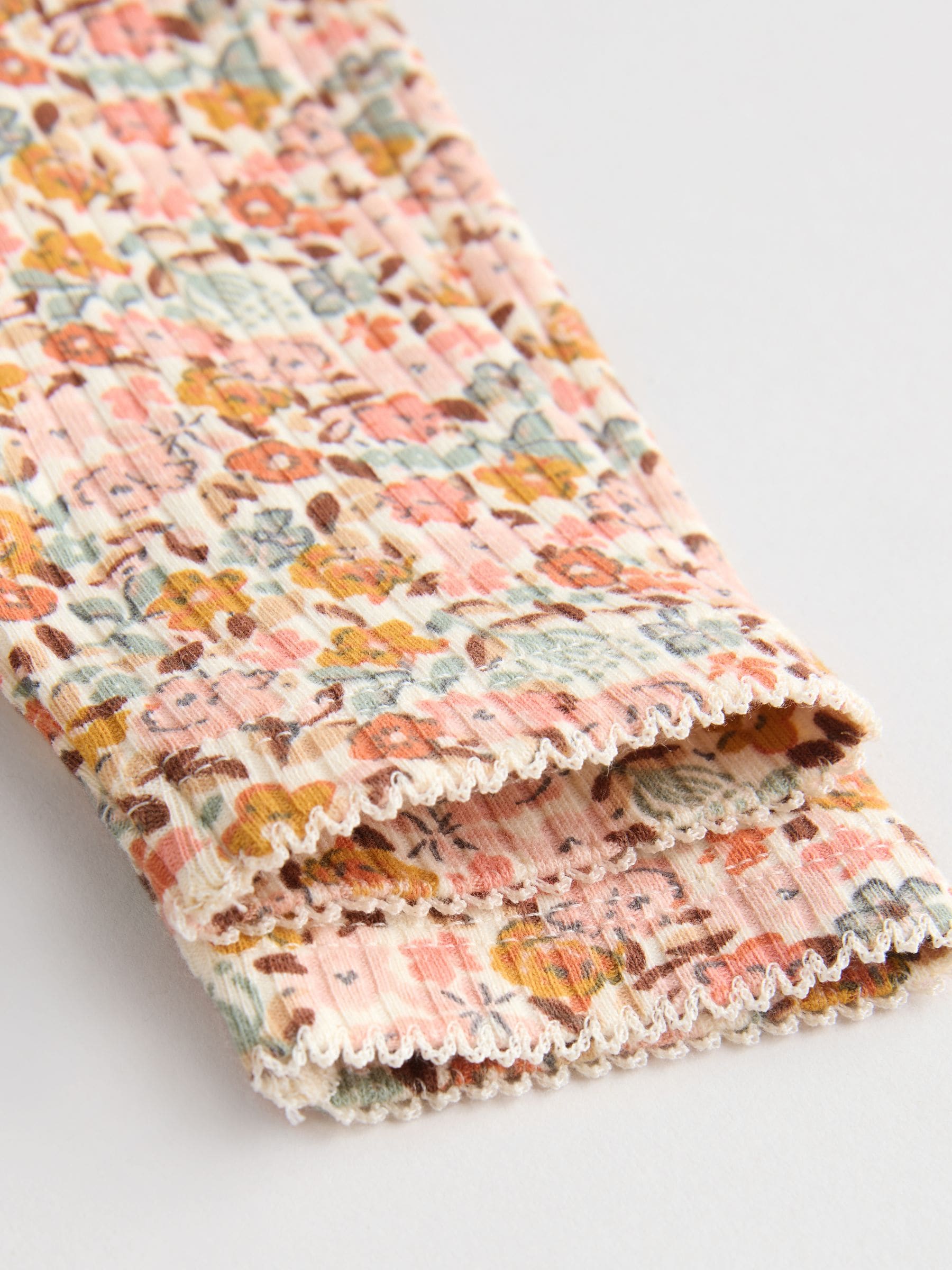 Blauw/crème/koraal Ditsy - Verpakking van 4 babyrompers met lange mouwen en ruches (0mnd-2jr)