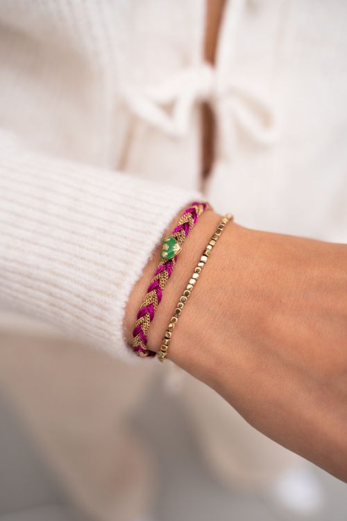Roze gevlochten armband met bedel