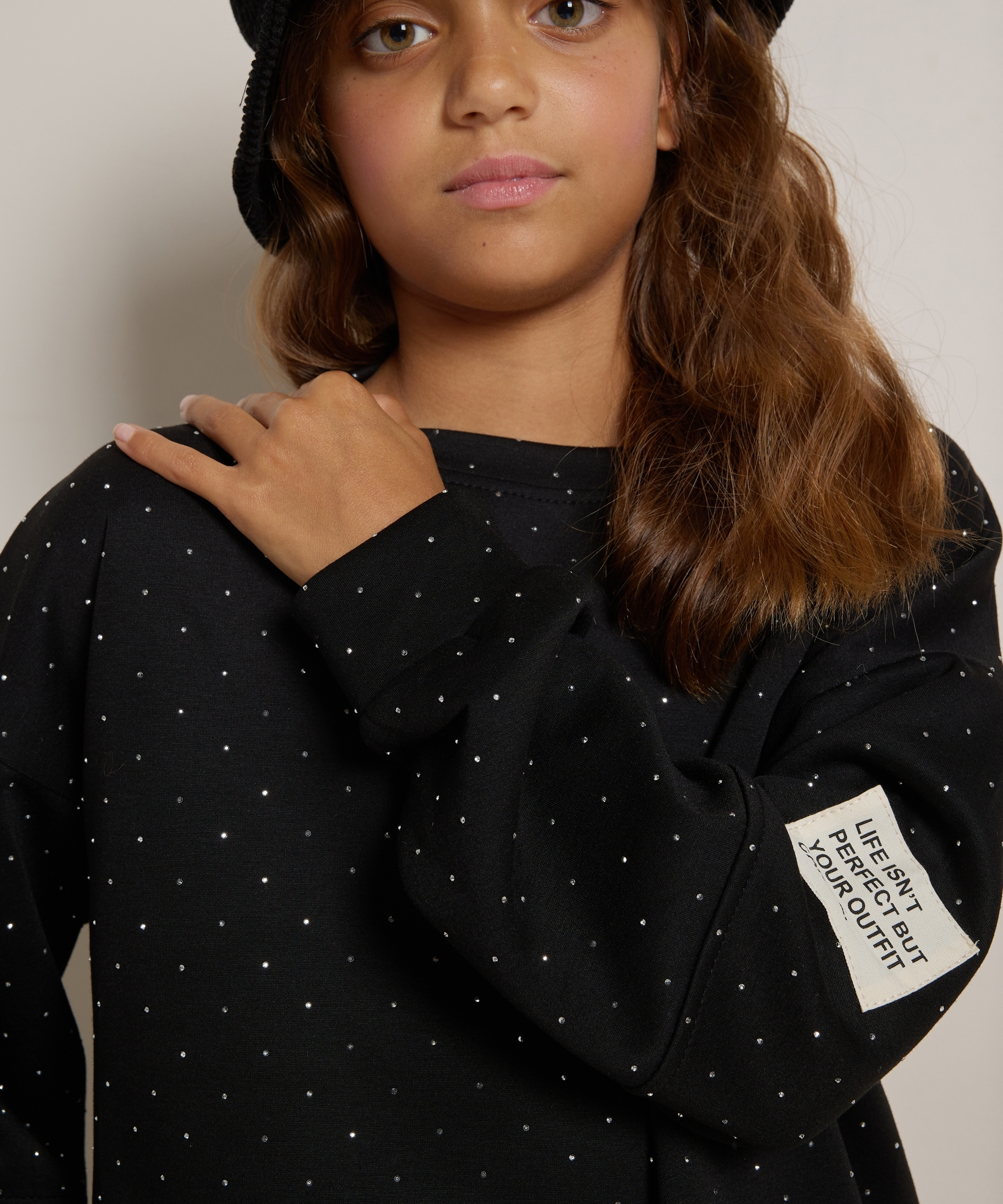 glitter trui mouwlabel
