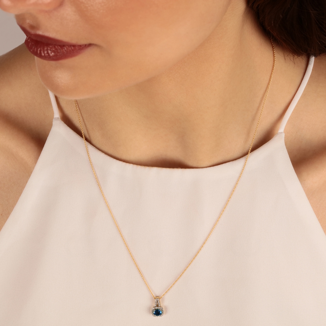 Anhänger 750/18 K Gelbgold mit Saphir oval und Diamanten 0.11 ct H/si
