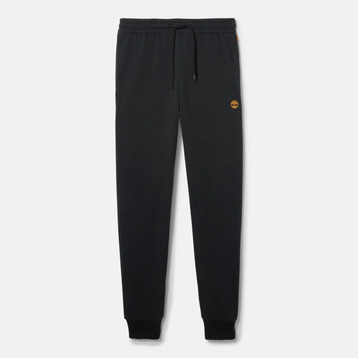 Calça de fato de treino feminina preta com bordado de árvore.