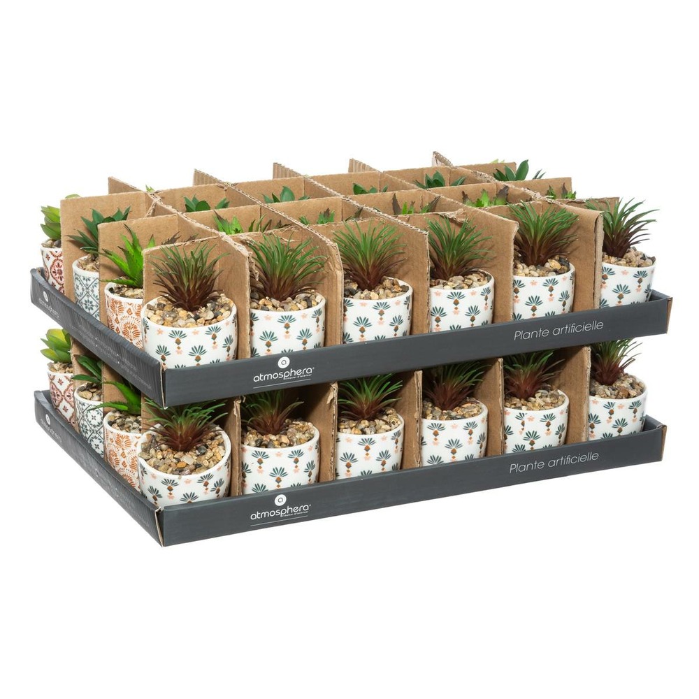 Plante artificielle verte dans un pot en céramique